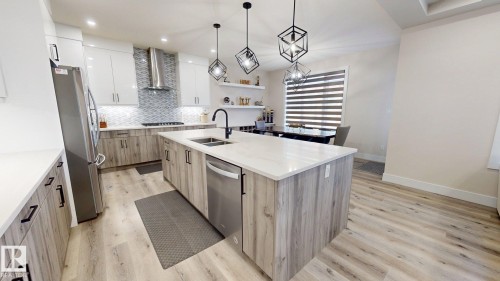 5813 Pelerin Crescent, Beaumont, AB - Indoor Photo Showing Kitchen With Double Sink With Upgraded Kitchen