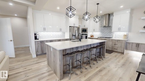 5813 Pelerin Crescent, Beaumont, AB - Indoor Photo Showing Kitchen With Double Sink With Upgraded Kitchen