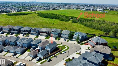 Aerial perspective showcasing a residential development with a modern architectural style - 17359 49 Street Nw, Edmonton, AB - Outdoor With View