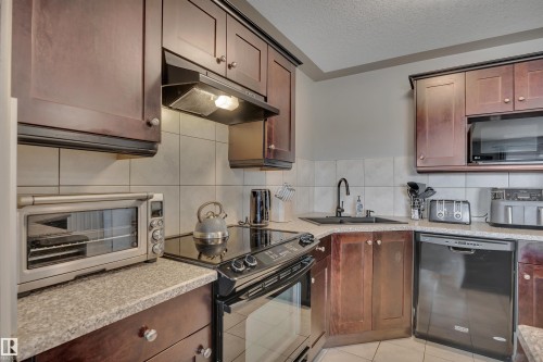 #411 4415 48 St, Leduc, AB - Indoor Photo Showing Kitchen With Double Sink