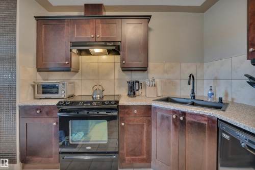 #411 4415 48 St, Leduc, AB - Indoor Photo Showing Kitchen With Double Sink