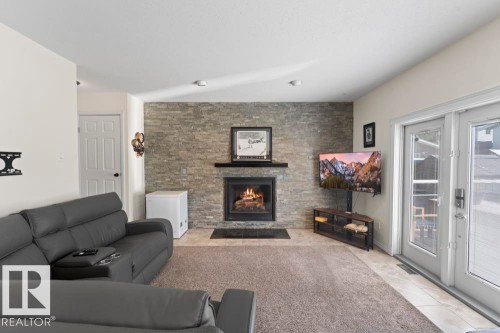 5003 43 Street, Cold Lake, AB - Indoor Photo Showing Living Room With Fireplace