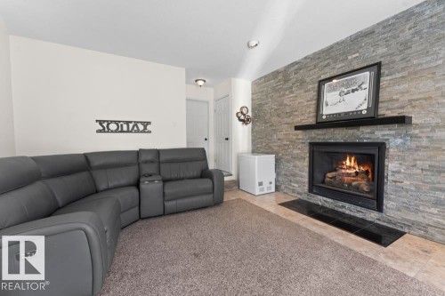 5003 43 Street, Cold Lake, AB - Indoor Photo Showing Living Room With Fireplace