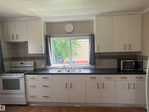 5113 Fifth Street, Boyle, AB - Indoor Photo Showing Kitchen With Double Sink