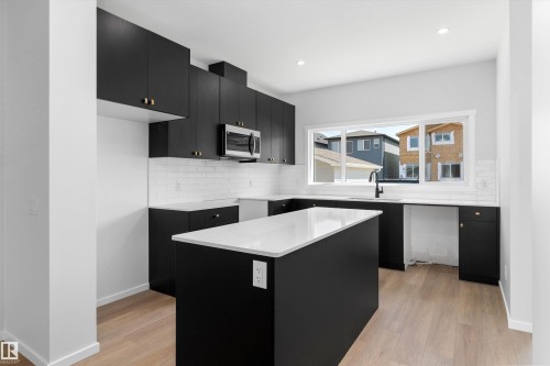 2463 Alces Link Sw, Edmonton, AB - Indoor Photo Showing Kitchen With Upgraded Kitchen
