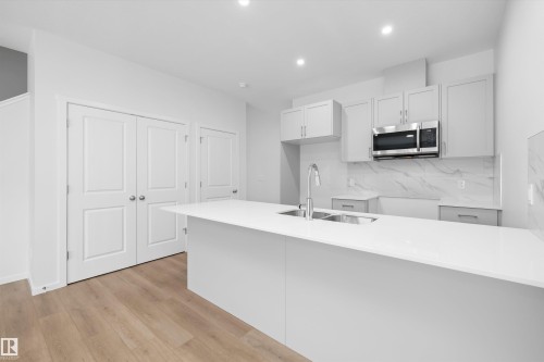 9105 Elves Loop Nw, Edmonton, AB - Indoor Photo Showing Kitchen With Double Sink