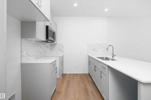 9105 Elves Loop Nw, Edmonton, AB - Indoor Photo Showing Kitchen With Double Sink