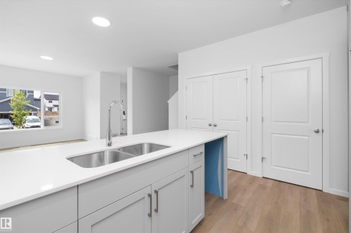 9105 Elves Loop Nw, Edmonton, AB - Indoor Photo Showing Kitchen With Double Sink
