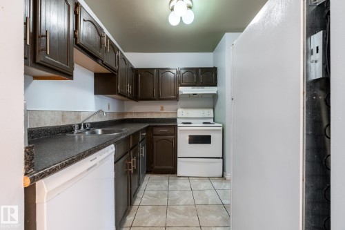 #703 10175 109 St Nw, Edmonton, AB - Indoor Photo Showing Kitchen With Double Sink