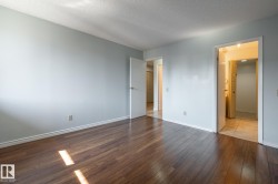 spacious primary bedroom with ensuite half bath and walk through closet - 