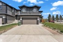 Contemporary facade featuring dark gray siding and white trim - 4506 49 Avenue, Beaumont, AB  - Outdoor With Facade 
