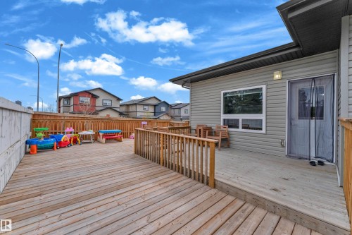 Expansive outdoor deck featuring wood planking and wood railings - 4506 49 Avenue, Beaumont, AB - Outdoor With Deck Patio Veranda With Exterior