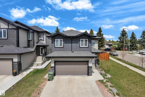 Modern two-story residence featuring dark gray siding and white trim - 4506 49 Avenue, Beaumont, AB - Outdoor With Facade