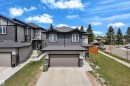 Modern two-story residence featuring dark gray siding and white trim - 4506 49 Avenue, Beaumont, AB  - Outdoor With Facade 