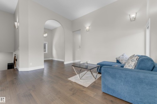 Open-concept living space with wide plank wood-finish flooring - 4506 49 Avenue, Beaumont, AB - Indoor Photo Showing Living Room
