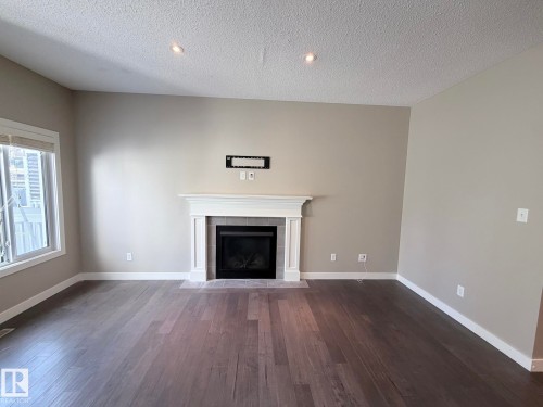 3831 170 Avenue Northwest, Edmonton, AB - Indoor Photo Showing Living Room With Fireplace
