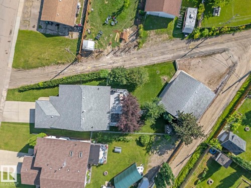 House includes double attached heated garage, concrete front parking PLUS 34x34 HEATED SHOP with extra parking off alley. - 1303 5 Avenue, Cold Lake, AB - Outdoor With View