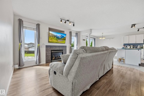 214 Hyndman Crescent Nw, Edmonton, AB - Indoor Photo Showing Living Room With Fireplace