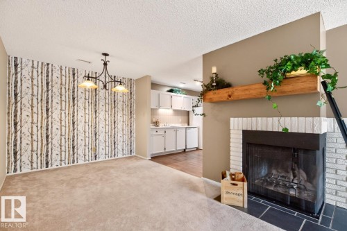 #31 2115 118 St Nw, Edmonton, AB - Indoor Photo Showing Living Room With Fireplace