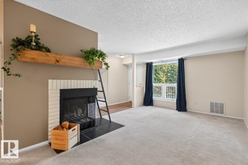 #31 2115 118 St Nw, Edmonton, AB - Indoor Photo Showing Other Room With Fireplace
