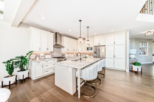 9034 24 Ave Sw, Edmonton, AB - Indoor Photo Showing Kitchen With Fireplace With Double Sink