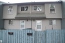 Exterior facade featuring light gray siding, white-framed windows, and a gray shingle roof - 14210 31 Street Nw, Edmonton, AB  - Outdoor 