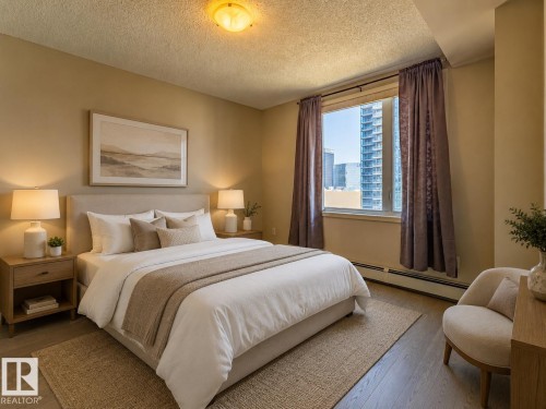 Bedroom featuring a window with city views, wood-finish flooring, and a textured area rug - #1501 10180 104 St Nw, Edmonton, AB - Indoor Photo Showing Bedroom
