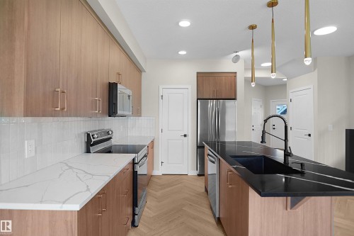 8523 Mayday Run Sw, Edmonton, AB - Indoor Photo Showing Kitchen With Stainless Steel Kitchen With Double Sink With Upgraded Kitchen