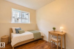 Warm-toned wall paint complements the rich wood-finish flooring - 
