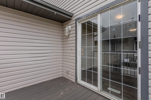 Sliding glass patio door with grid pattern - #D 10102 103 St, Morinville, AB - Outdoor With Exterior
