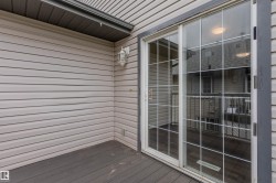 Sliding glass patio door with grid pattern - 