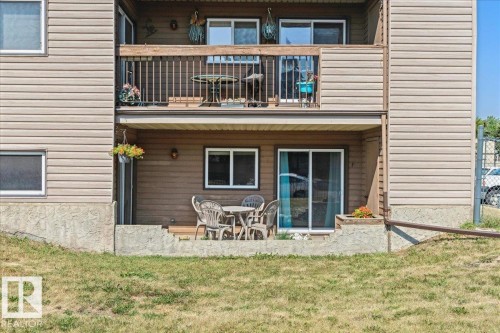 Ground-level patio with sliding glass door access - #112 2904 139 Av Nw, Edmonton, AB - Outdoor With Deck Patio Veranda With Exterior