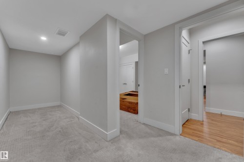Carpeted room with recessed lighting and a white baseboard trim - 3001 55 Street, Beaumont, AB - Indoor Photo Showing Other Room