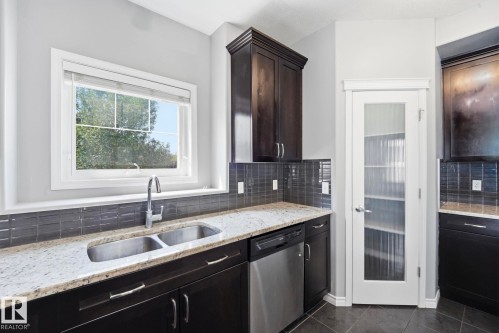 7043 22 Avenue Sw, Edmonton, AB - Indoor Photo Showing Kitchen With Double Sink