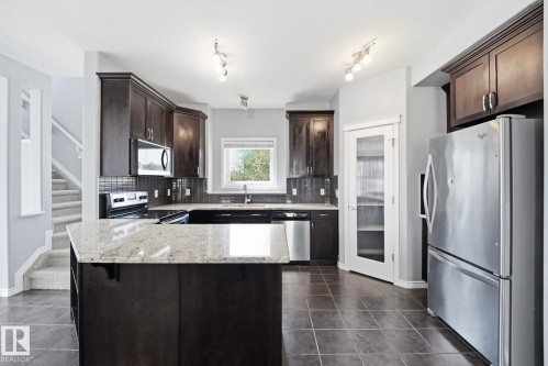 7043 22 Avenue Sw, Edmonton, AB - Indoor Photo Showing Kitchen With Stainless Steel Kitchen With Upgraded Kitchen