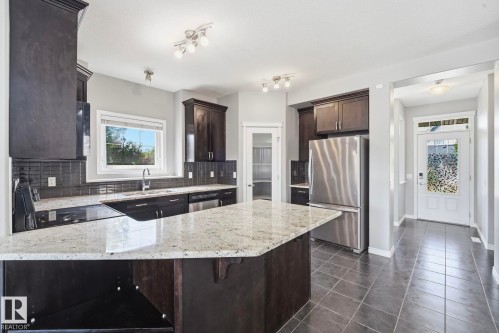 7043 22 Avenue Sw, Edmonton, AB - Indoor Photo Showing Kitchen With Stainless Steel Kitchen With Upgraded Kitchen