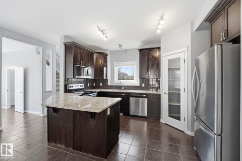 7043 22 Avenue Sw, Edmonton, AB - Indoor Photo Showing Kitchen With Stainless Steel Kitchen With Upgraded Kitchen