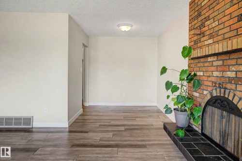 Edmonton, AB - Indoor Photo Showing Other Room With Fireplace