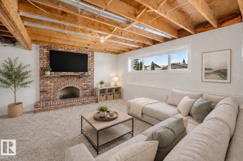 Edmonton, AB - Indoor Photo Showing Living Room With Fireplace