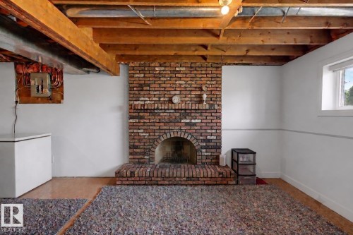 Edmonton, AB - Indoor Photo Showing Other Room With Fireplace