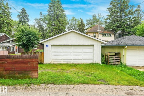 Detached garage with a single overhead door and a white exterior finish - 9824 91 Avenue Nw, Edmonton, AB - Outdoor