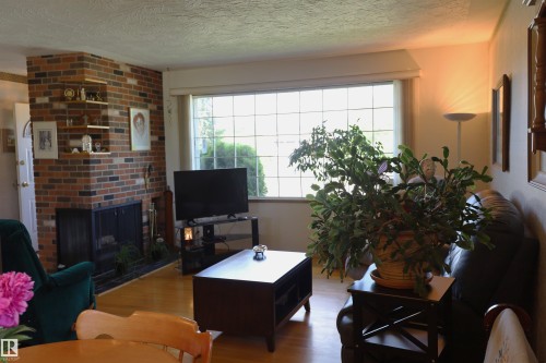 10715 132 Avenue Nw, Edmonton, AB - Indoor Photo Showing Living Room With Fireplace