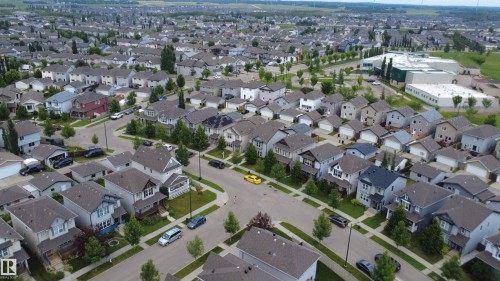 Residential neighborhood featuring a variety of single-family homes with pitched roofs, front yards, and mature trees lining the streets - 1528 35 Avenue Nw, Edmonton, AB -  With View