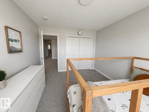 Light gray wall paint complemented by gray carpeting - 1327 20 Nw, Edmonton, AB - Indoor