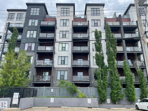Multi-story building featuring modern architecture with contrasting dark and light gray facades - 504 10518 113 Street, Edmonton, AB - Outdoor With Balcony With Facade