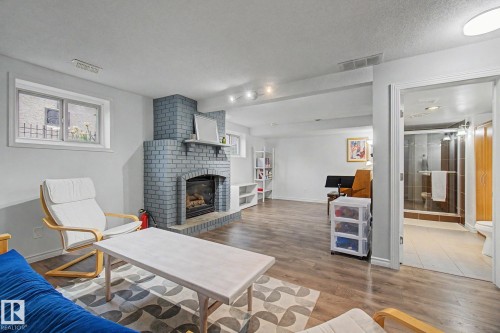 3706 41 Avenue Nw, Edmonton, AB - Indoor Photo Showing Living Room With Fireplace
