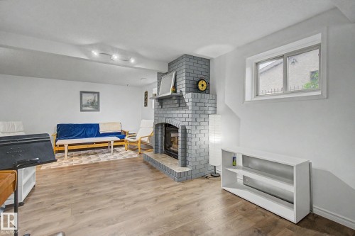 3706 41 Avenue Nw, Edmonton, AB - Indoor Photo Showing Living Room With Fireplace