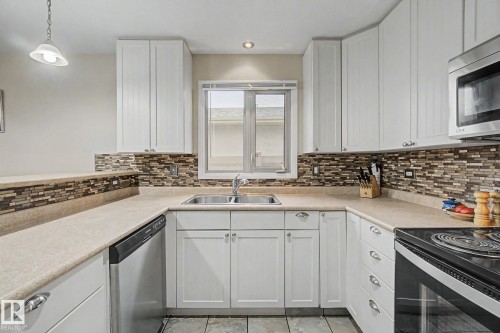 3706 41 Avenue Nw, Edmonton, AB - Indoor Photo Showing Kitchen With Double Sink