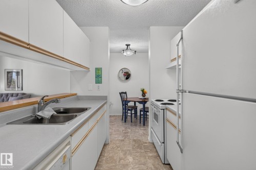 #414 10636 120 St Nw, Edmonton, AB - Indoor Photo Showing Kitchen With Double Sink