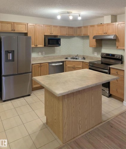 #6211 7331 South Terwillegar Dr Nw, Edmonton, AB - Indoor Photo Showing Kitchen With Double Sink